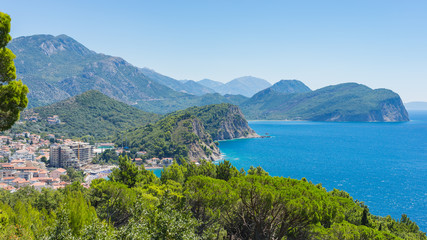 Fototapeta na wymiar View rocky coastline of Montenegro. In the foreground the villag