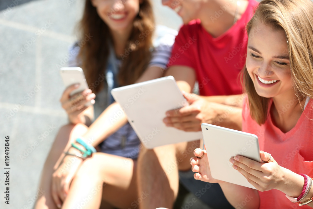 Wall mural Young people with gadgets