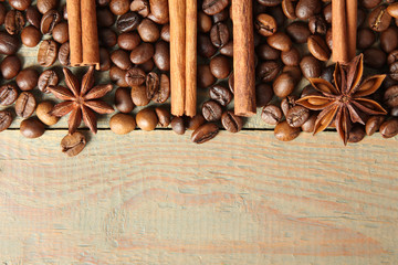 Coffee beans on wooden brown background. Copy space