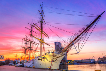 Sailboat in Gdynia harbour at sunset, Poland