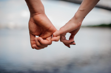 Happy couple holding hands together