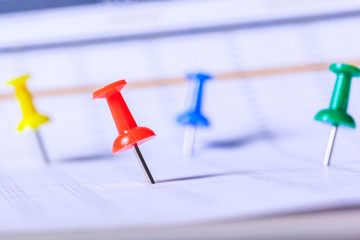 Concept image of a calendar with red push pin