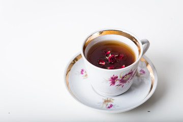 Cup of black tea in a china cup and saucer