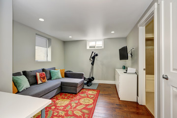 Sitting room interior with sport equipment in the basement