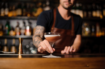 Barman at work, serving cocktails. no face