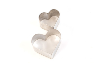 Heart shape cookie molds on white background,soft focus