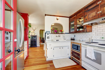 Vintage kitchen cabinets and white tile back splash trim