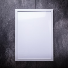 Blank white picture frame on the wall