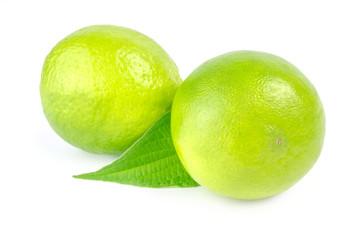 Two lime with leaf on white