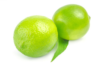 Two lime with leaf on white background