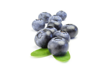 some fresh blueberries one after the other isolated on white