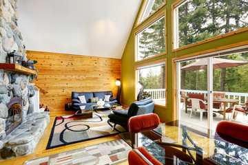House interior with vaulted ceiling and glass wall