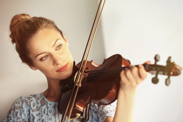 Beautiful woman playing violin