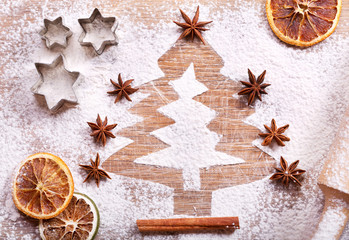 Obraz na płótnie Canvas Christmas tree made from flour on desk, ingredients for baking a