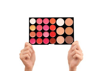 Female hands holding eye shadow palette, isolated on white