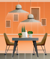 Interior of orange dining room with lamps and pictures on the wall
