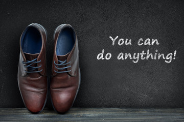 You can do anything text on black board and business shoes