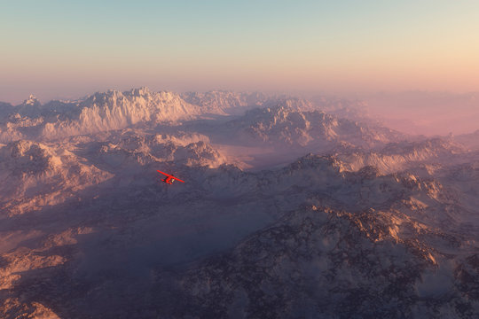 Misty snow mountains in morning mist with airplane flying over