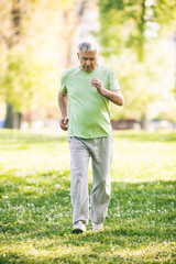 Senior man is jogging in park. Active retirement.