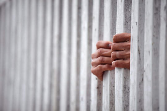 hand of prisoner in jail