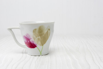 Tea cup on white wooden