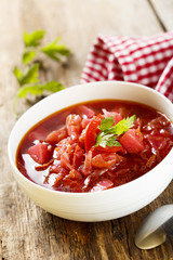 Beetroot soup in white bowl