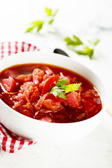 Beetroot soup in white bowl