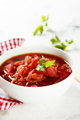 Beetroot soup in white bowl