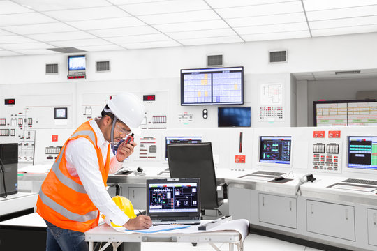 Engineer working at control room of thermal power plant