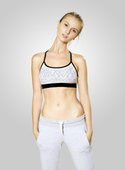 Fototapeta premium Young woman posing in sport clothes