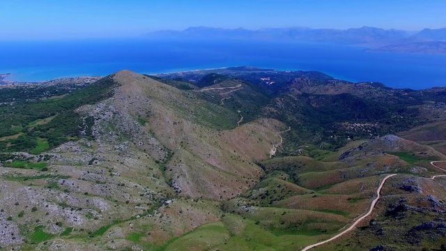 Mount Pantokrator Corfu Greece aerial 4k panoramic video. View of sea strait, top mountain summit, coast shore