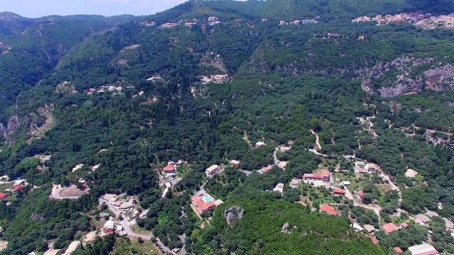 Corfu Paleokastritsa Greece village aerial 4k travel video. Forest mountain hills, villas resort