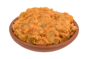Portion of spicy chicken salad in a small bowl on a white background.