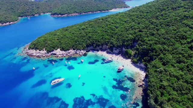 Tropical Ionian Greece island aerial 4k travel video. Ocean sea forest coast seashore, beach harbor bay, blue water, yacht boat