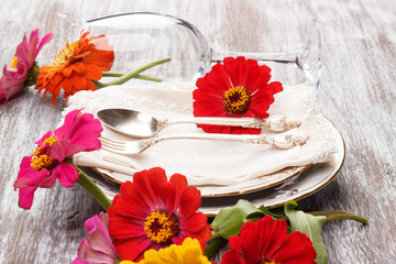 Tableware and silverware with zinnia