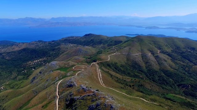 Mount Pantokrator Corfu Greece aerial HD panoramic video. View of sea strait, top mountain summit, coast shore