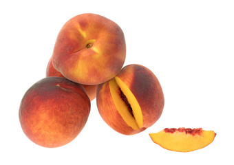 Whole nectarines with a slice isolated on a white background.
