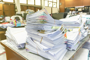 Pile of documents on desk at workplace