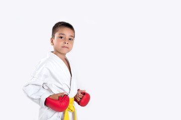 karateka with a yellow belt and red gloves