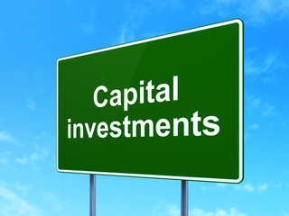 Banking concept: Capital Investments on road sign background