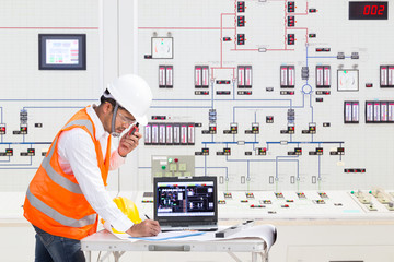 Engineer working at control room of thermal power plant