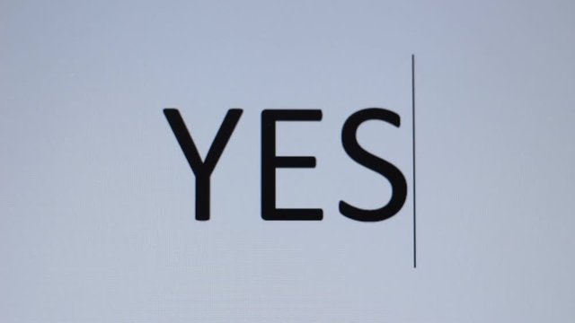 Somedody prints "Yes" on a computer