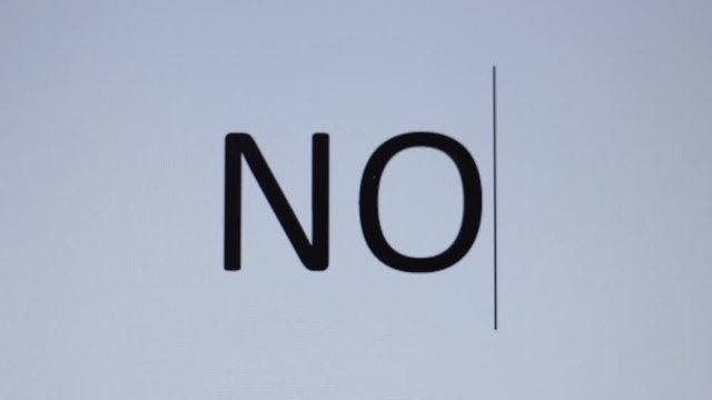 Somebody writes "No" on a computer