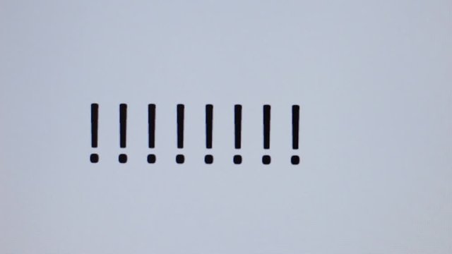 Somebody writes exclamation mark on a computer