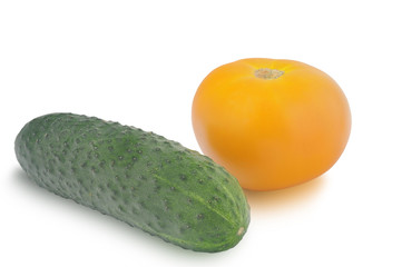 One cucumber and yellow tomato isolated on white background