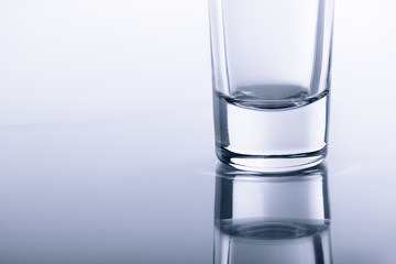 bottom transparent glasses on the glass with reflection.