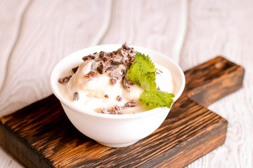 vanilla ice cream with chocolate, decorated mint, close up