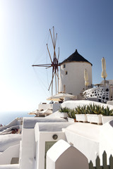 Windmill of Oia town at sunny day, Santorini