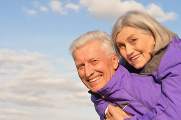 elderly couple  on the background of sky