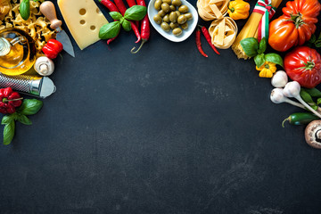 Italian food ingredients on slate background